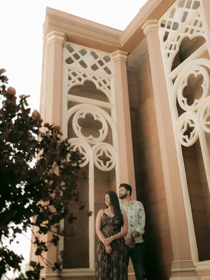 Using architectural elements to frame a couple, this shot adds a sense of grandeur and artistry to a pre-wedding portrait.