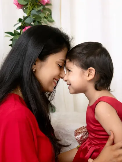 A quiet, intimate moment with foreheads touching. These are the simple, powerful moments that truly define the mother-daughter relationship.