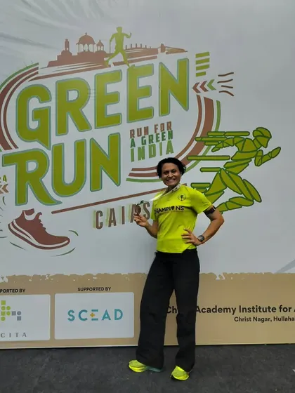 Posing with my medal at the Green Run. Running is always fun, but winning prize money makes it even more rewarding!