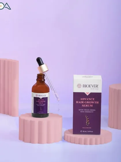 A product shot of a hair growth serum, using geometric props and a pastel purple background to create a modern and stylish composition.