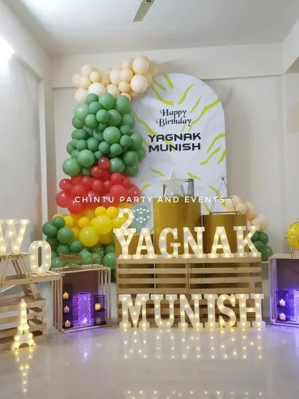 My rental props include light-up marquee letters to spell out names or words like 'TWO'. I also provide decorative wooden crates and other elements to build a unique and personalized photo corner for any event.