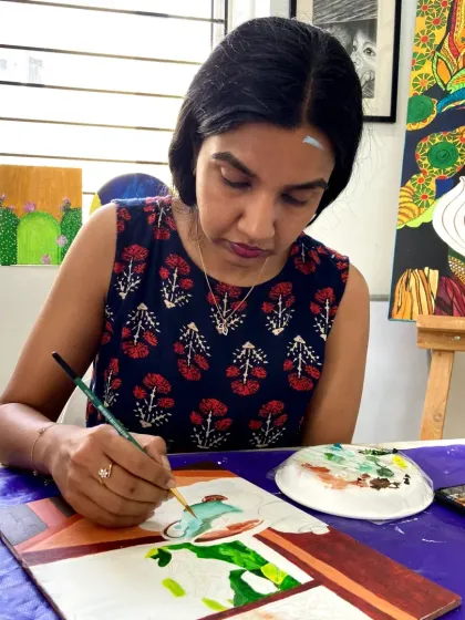 A student in our acrylics course working on a painting. The courses are designed to be a journey of creative discovery.