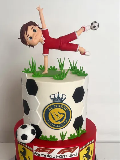 A close-up of the hand-sculpted football player figurine in mid-kick.