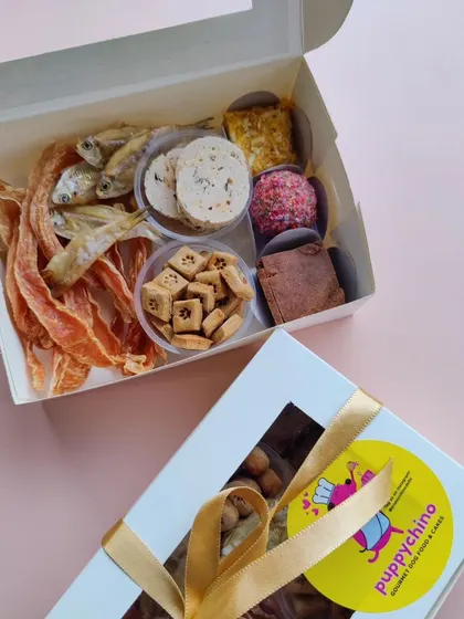This is my 'Moose's Chakhna Box', a savory delight for Diwali. It includes a mix of house-made salami, dehydrated anchovies, chicken jerky, and bite-sized biscuits for a crunchy, flavorful experience.