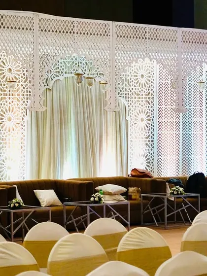 A wider view of the lounge setup, showing how it is positioned relative to the main guest seating, providing a dedicated space for relaxation.