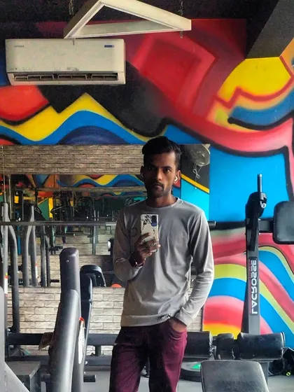 A selfie at The Fit Zone gym. The graffiti wall adds to the high-energy vibe of the space.
