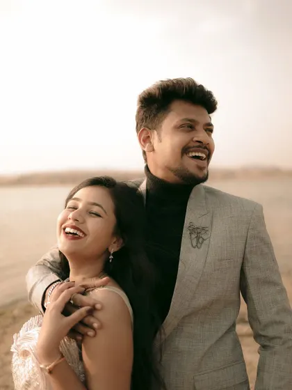Pure, unscripted laughter by the water. These are the moments that make your pre-wedding album truly yours.
