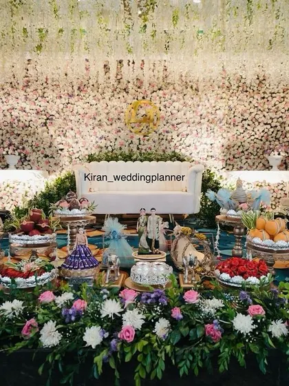 A full view of the engagement stage with a detailed display of traditional gifts and platters, all part of the comprehensive decor service I provide.