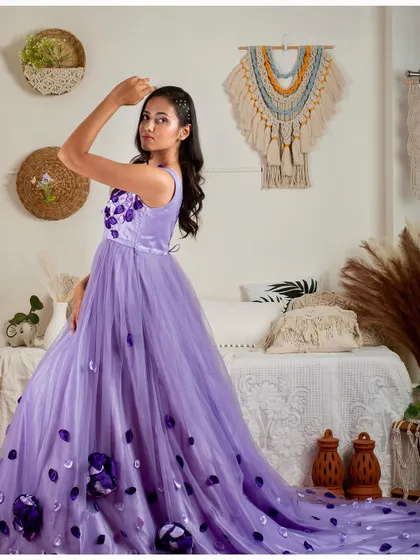 A model posing in the lavender gown in my studio, showing how the dress moves and drapes.