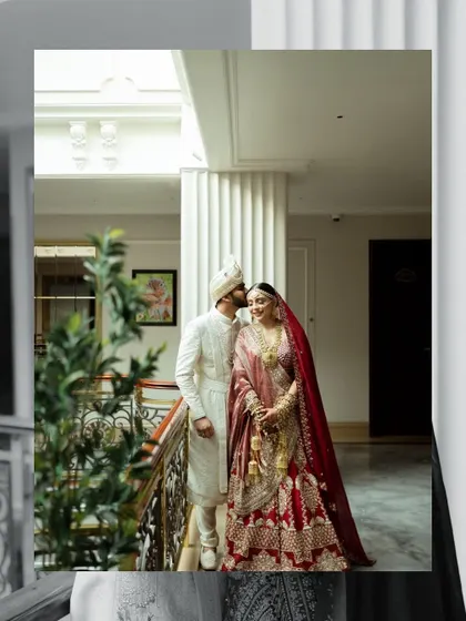 A romantic portrait of the couple in a quiet moment after their wedding. The groom kisses the bride's forehead, a tender gesture captured beautifully.