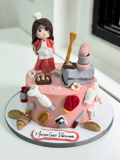 When baking dreams turn into art! This "Master Chef" cake celebrates the passion of a baker with tiny, handcrafted fondant tools, from piping bags to mixing bowls.