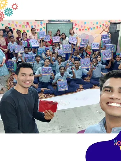 Our team celebrating a successful session with students, who are all smiles after a day of building and discovery.