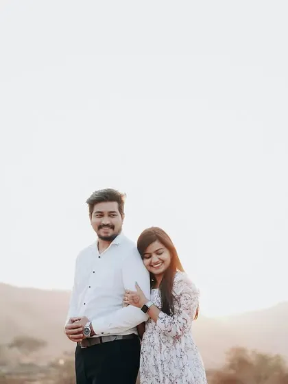 A simple and happy portrait against a bright, open sky. It’s a beautiful, clean shot that focuses on their connection.