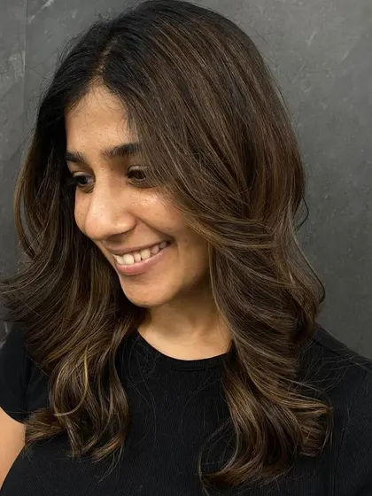 A happy client showing off her new look, her smile says it all.