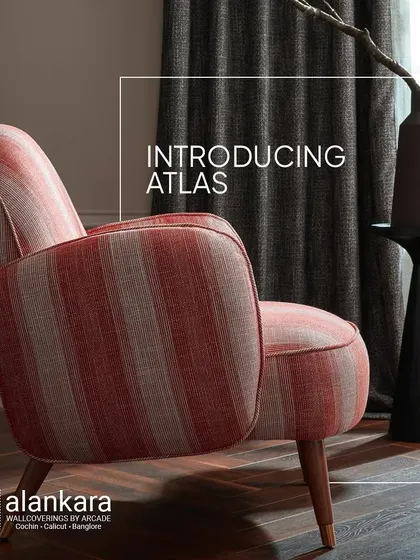 A beautiful armchair upholstered in a striped fabric from the Atlas collection, showcasing its rustic charm and modern elegance.