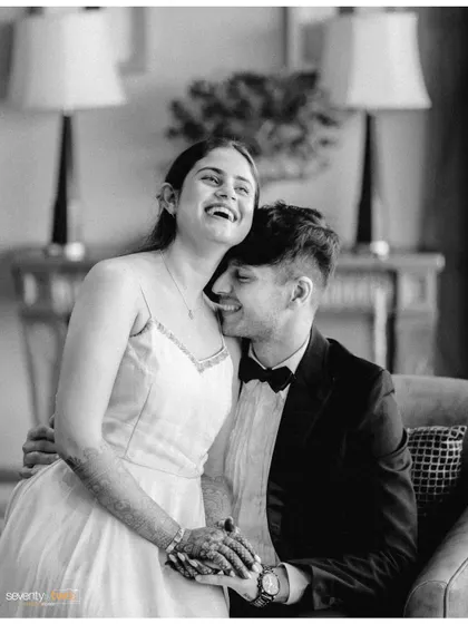 A moment of shared joy and laughter, captured in timeless black and white. It’s the in-between moments like these that often become the most cherished memories.