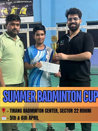 Another winner from the Summer Badminton Cup, proudly receiving his trophy. We thank all the participants for making the event a grand success.