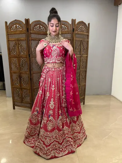 The detailed work on this pink lehenga is absolutely breathtaking, perfect for a special occasion.