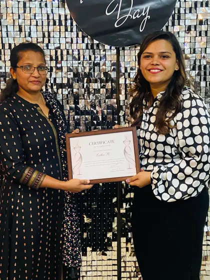 A student receives her well earned certificate, marking the end of her journey with us and the beginning of her new career.