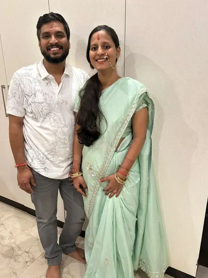 A happy, casual portrait of Ashutosh and Payal. Both dedicated to service and growth, they are creating a life filled with harmony and shared dreams.