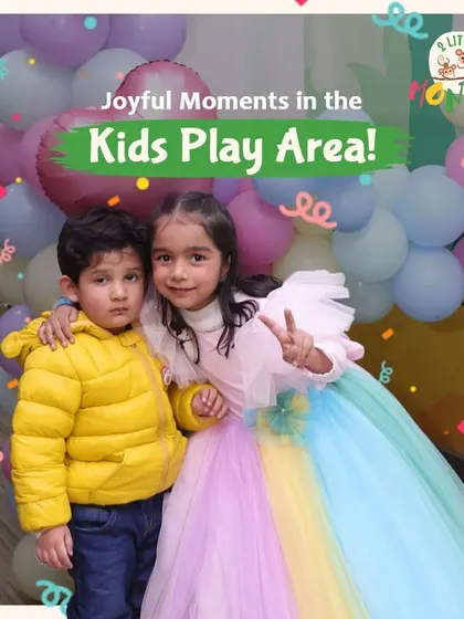 Joyful moments in the kids' play area are what we live for. These two siblings are all dressed up and ready to celebrate a special birthday with colorful balloons and lots of fun.