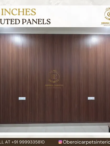 This 12-inch wide fluted panel in a dark wood finish covers an entire wall, providing a simple yet powerful backdrop for a bedroom or living area.