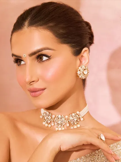 A beautiful close-up of Tara Sutaria, showcasing the intricate details of our Polki choker and matching earrings.