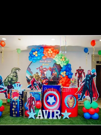 A full view of the action-packed Avengers setup for Avir's 3rd birthday, showcasing the character cutouts and themed decor.