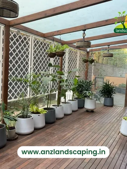 An identical shot of the finished sunroom, highlighting the clean wooden deck and the elegant lattice privacy screens.