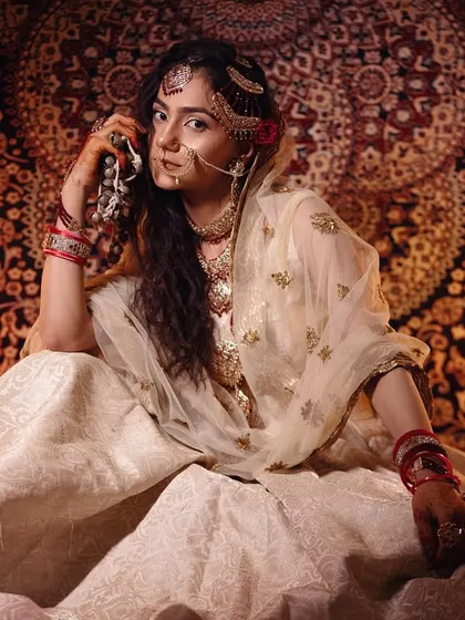 Moments from our Heeramandi-inspired shoot. These images showcase the intricate details of the makeup, hair, and styling, capturing the mood and opulence of the era.