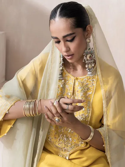 A close-up from the Saisha shoot, focusing on the details. This shot highlights the intricate embroidery on the yoke of the kurta and shows how I pair statement jewelry, like these large silver-tone earrings, to complete the ethnic look.