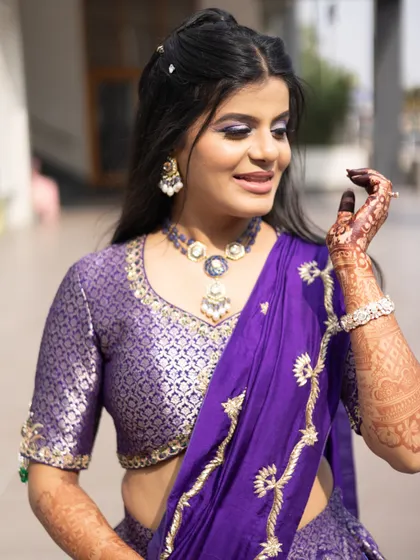 A close-up of the haldi look. The makeup is fresh and vibrant, and her smile says it all.