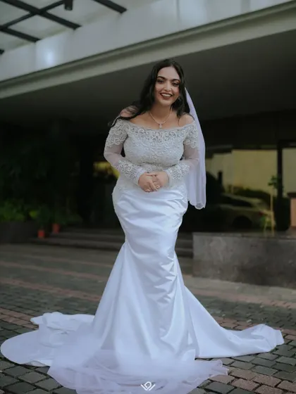 A candid shot of a Christian bride in her beautiful gown, her happy expression captured perfectly.