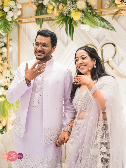 Showing off the rings that mark their promise. A joyful, candid shot from Rajat and Rachita's engagement party.