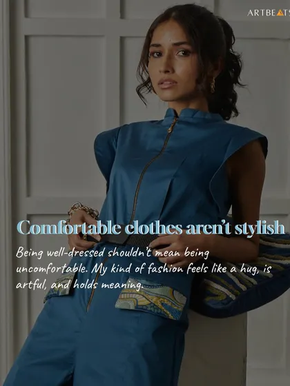 Comfortable clothes can be stylish. This deep blue jumpsuit with cap sleeves and art-detailed pockets proves that you don't have to sacrifice comfort for a well-dressed look.