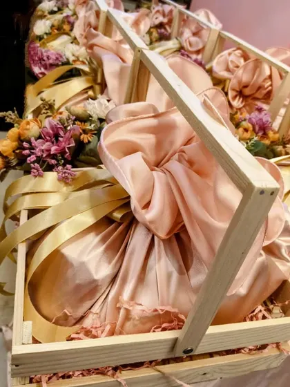 Another angle of the pinewood crate hampers for Hindustan Unilever, showcasing the elegant fabric wrapping and floral accents. This is a great example of sustainable yet beautiful corporate packaging.