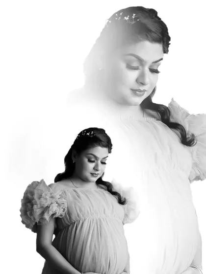 An artistic double exposure in black and white, creating a dreamy and ethereal solo portrait that captures the introspective mood of pregnancy.