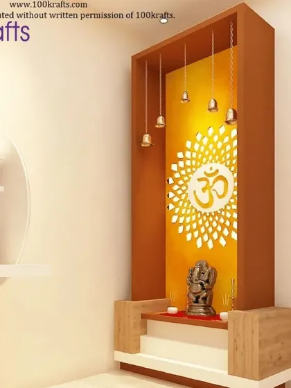 A compact and modern pooja unit from our 'Modern Traditional Glam' project. The design features a backlit 'Om' jali panel and hanging bells, creating a divine focal point next to the study desk.
