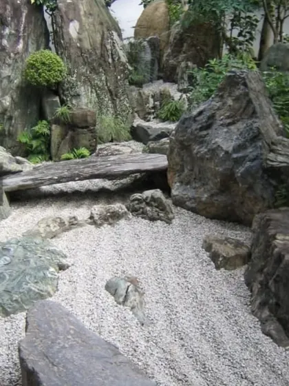 I create authentic Zen gardens that serve as a peaceful retreat. This project uses a combination of large natural stones, carefully raked gravel, and minimalist planting to build a space for quiet contemplation.