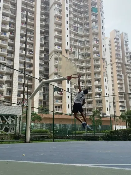 I lead by example on the court. This is me showing the kids what is possible with dedication. A dunk is not just about jumping, it is about power, timing, and practice.