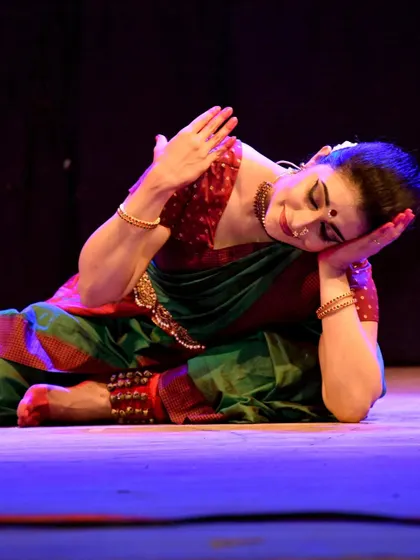 A moment of rest and contemplation on the floor during the Kanhopatra performance.