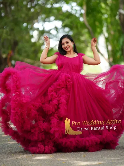 A fun and expressive shot, with the magenta ruffled gown spread wide.