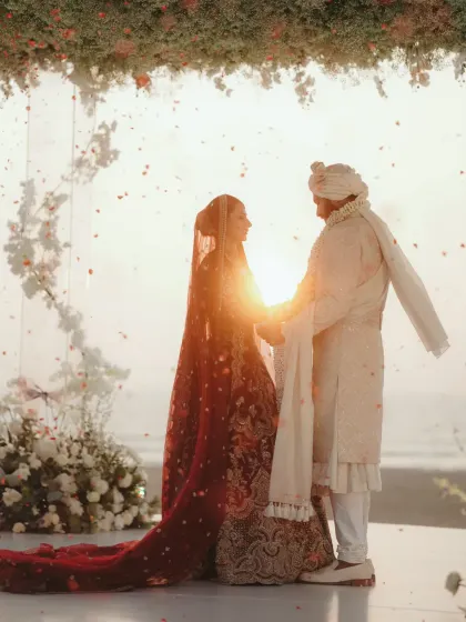A stunning shot of the couple at sunset, with the light creating a beautiful silhouette. Pure romance.