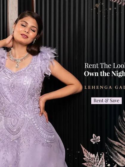 This lavender gown with feather-detailed shoulders is a dreamy and elegant option for a reception. The soft color and sparkling embellishments create a romantic and sophisticated look.