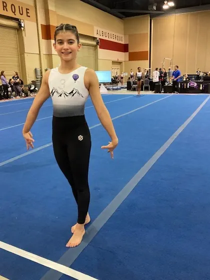 This Level 8 gymnast competed with grace and power at the regional championships.