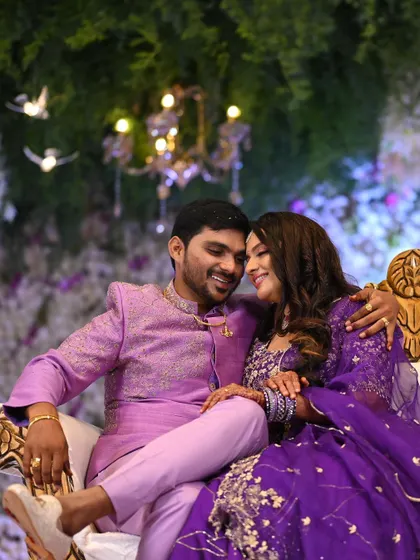 Another beautiful, intimate shot of the couple at their reception. The bride's makeup is flawless, enhancing her features as she shares a happy moment with her partner.