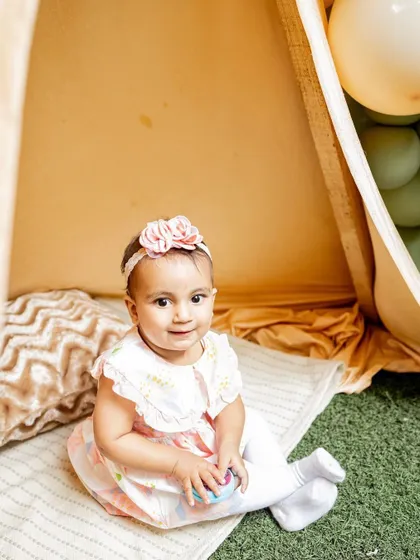 A sweet portrait of the birthday girl in her party tent. These setups make for wonderful photo opportunities during the celebration.