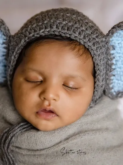 Look at those ears! This tiny elephant, with a grey crocheted hat, is sleeping so peacefully.