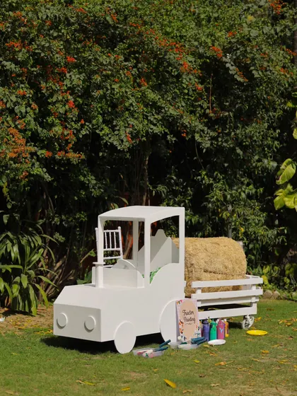 The full view of our custom-built tractor prop, designed as both a photo opportunity and an interactive painting station.
