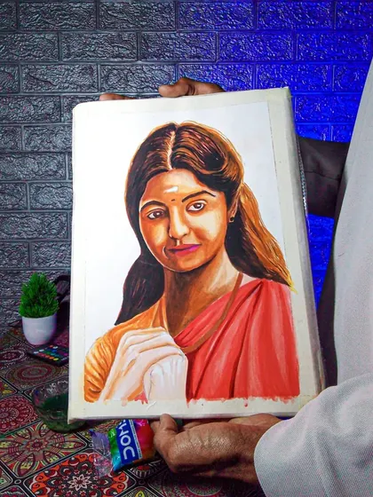 A watercolor portrait of an actress, shown partially completed. This image displays the process of building up color layers to create a realistic painting.